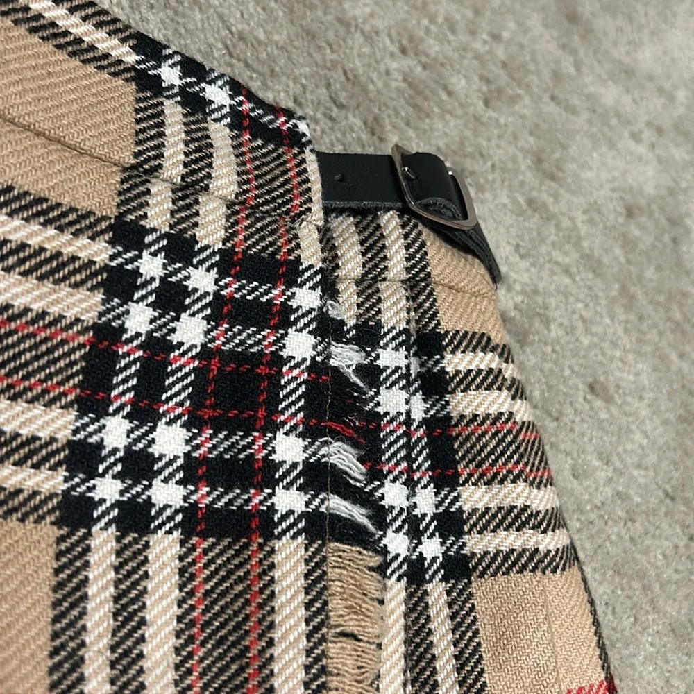 Toddler plaid skirt measures approximately 10 1/2 inches across the waist. - Picture 3 of 8